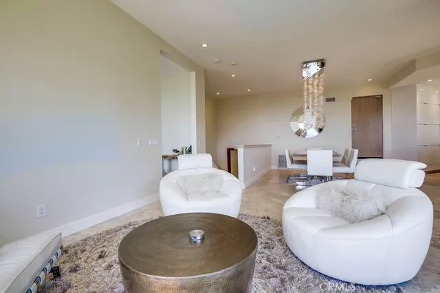 a kitchen with kitchen island granite countertop a sink a counter top space appliances and cabinets