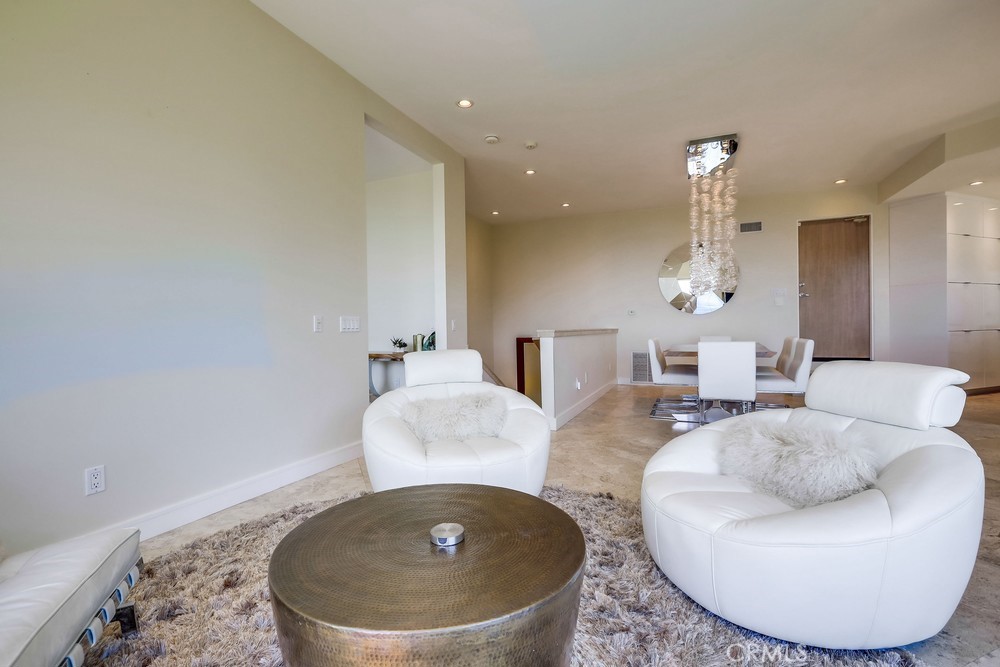 1725 Del Mar Avenue Laguna Beach, CA 92651 - Photo 21 of 63 a living room with furniture and a chandelier