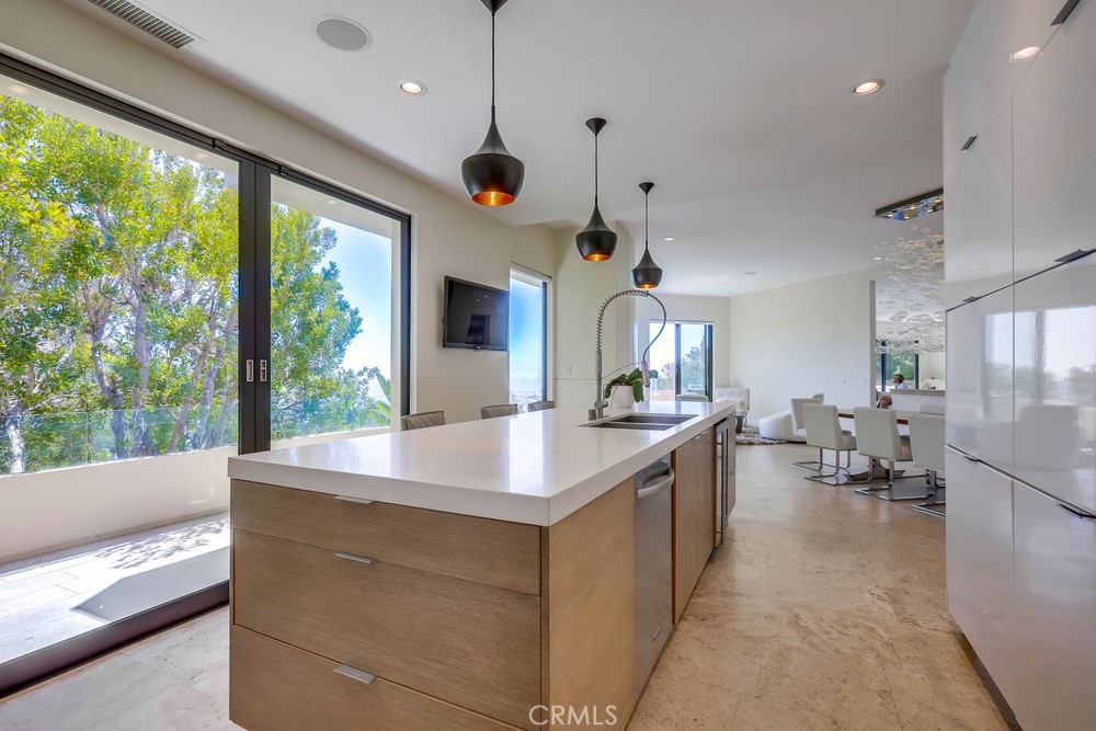 1725 Del Mar Avenue Laguna Beach, CA 92651 - Photo 29 of 63 a large kitchen with kitchen island a large island in it