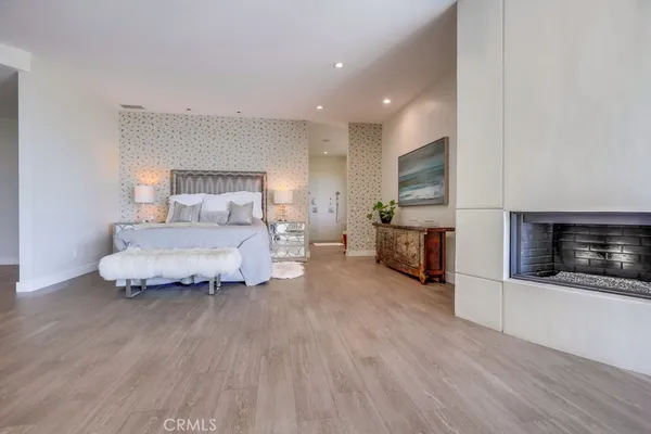 a white bath tub sitting in a bathroom next to a window