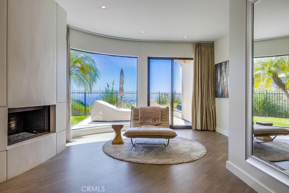 1725 Del Mar Avenue Laguna Beach, CA 92651 - Photo 34 of 63 a living room with furniture and a flat screen tv