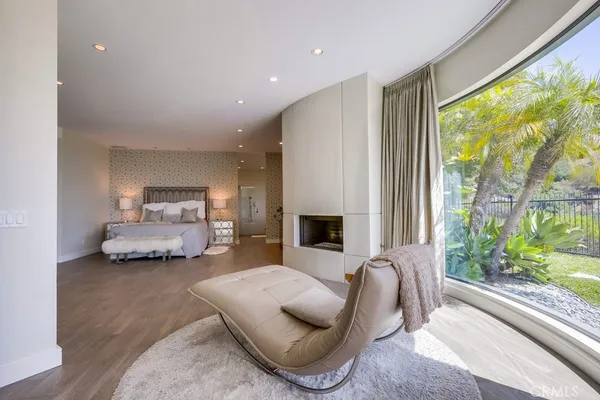 an empty room with wooden floor and furniture