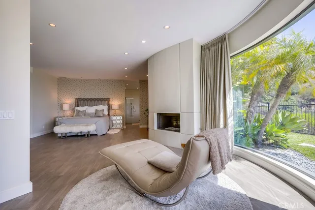 an empty room with wooden floor and furniture