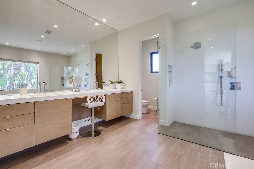 1725 Del Mar Avenue Laguna Beach, CA 92651 - Photo 36 of 63 a room with a wooden bed and furniture