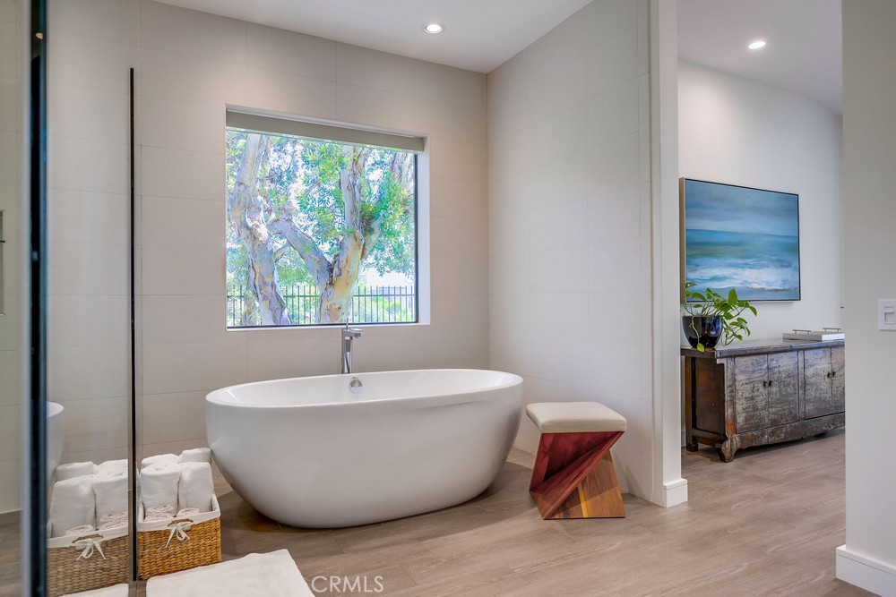 1725 Del Mar Avenue Laguna Beach, CA 92651 - Photo 37 of 63 a white bath tub sitting in a bathroom next to a window