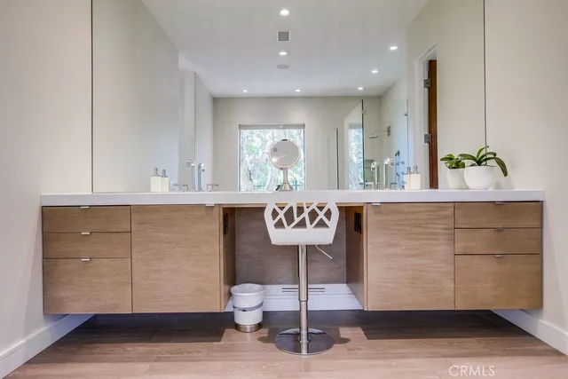 a bedroom with a bed and a chair