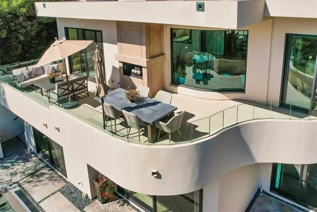 a view of a house with backyard and swimming pool