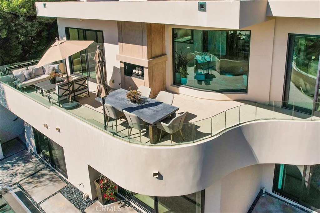 1725 Del Mar Avenue Laguna Beach, CA 92651 - Photo 4 of 63 a view of a patio with table and chairs with wooden floor and fence