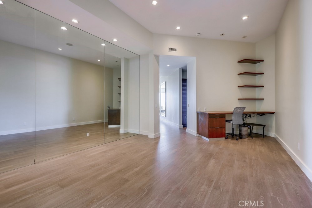 1725 Del Mar Avenue Laguna Beach, CA 92651 - Photo 43 of 63 an empty room with wooden floor and furniture