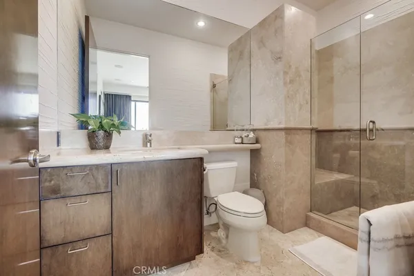 an aerial view of residential houses with city view