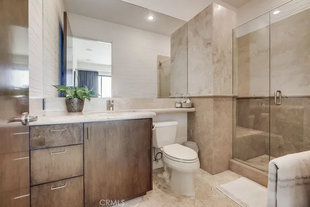 an aerial view of residential houses with city view