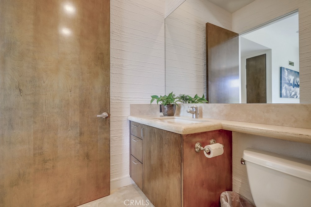 1725 Del Mar Avenue Laguna Beach, CA 92651 - Photo 50 of 63 a bathroom with a sink and mirror