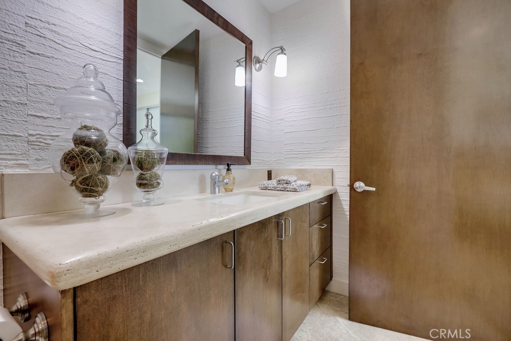 1725 Del Mar Avenue Laguna Beach, CA 92651 - Photo 53 of 63 a bathroom with a sink and a mirror