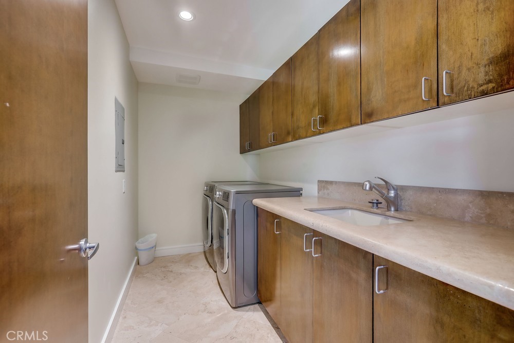 1725 Del Mar Avenue Laguna Beach, CA 92651 - Photo 54 of 63 a utility room with a sink a washer and dryer