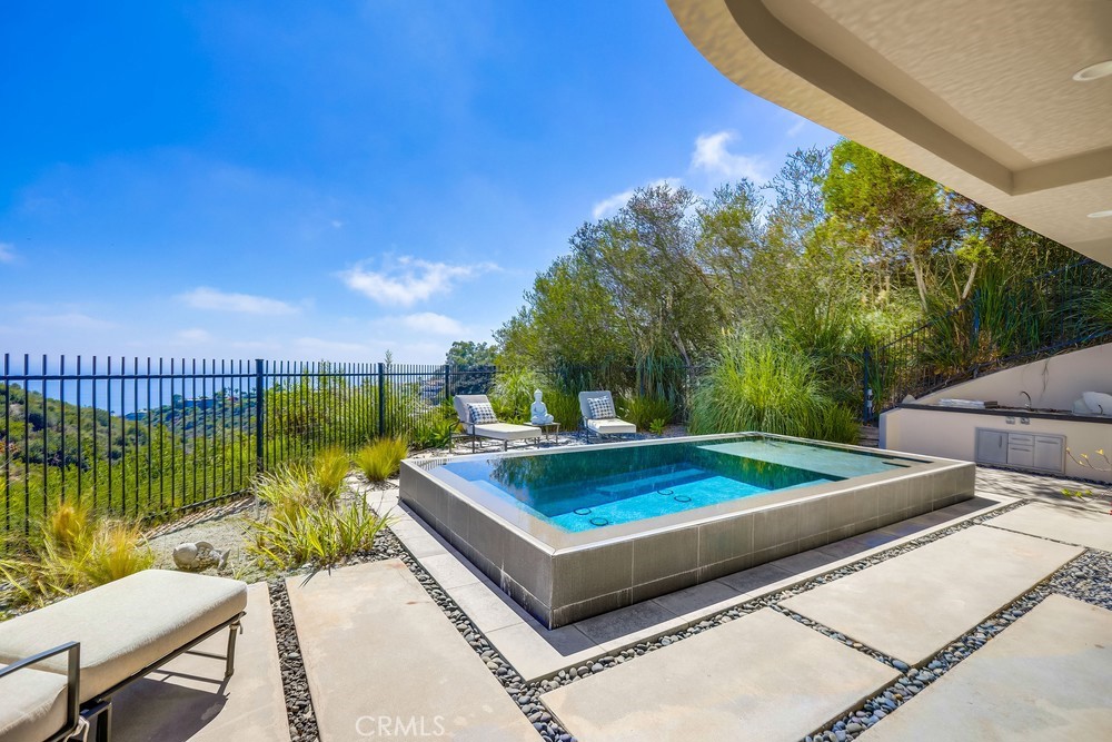 1725 Del Mar Avenue Laguna Beach, CA 92651 - Photo 56 of 63 a view of a backyard with couches plants and large tree
