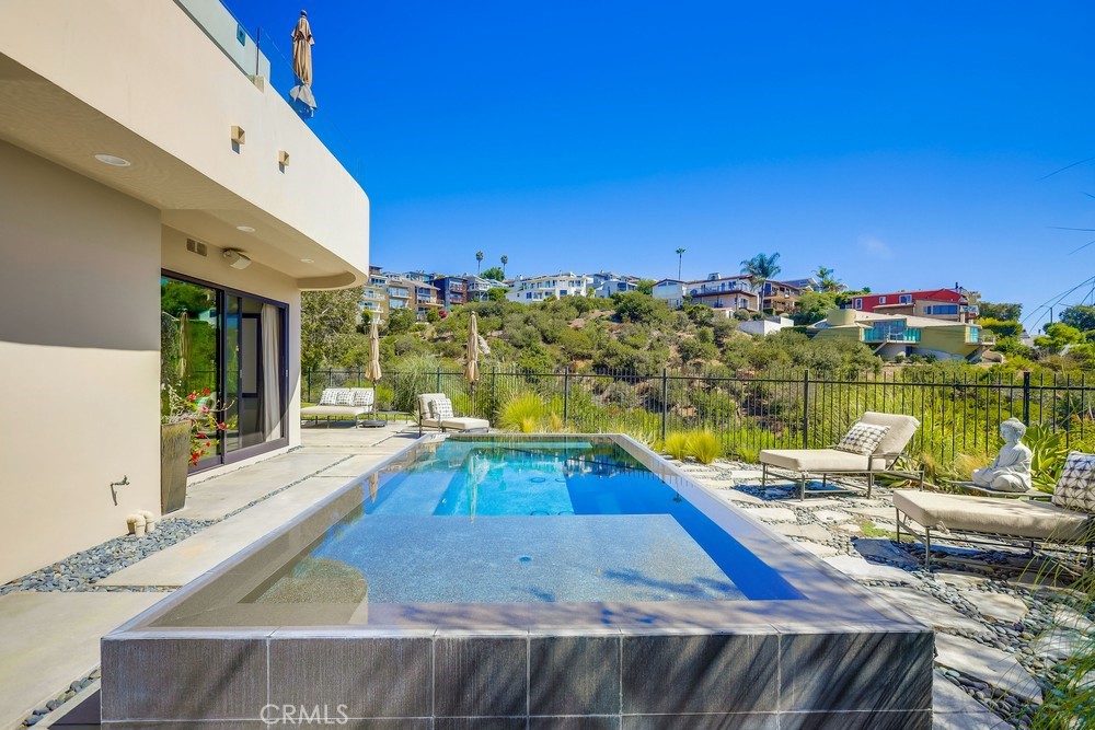 1725 Del Mar Avenue Laguna Beach, CA 92651 - Photo 57 of 63 a view of a swimming pool with an ocean view
