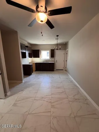 a large kitchen with cabinets and stainless steel appliances
