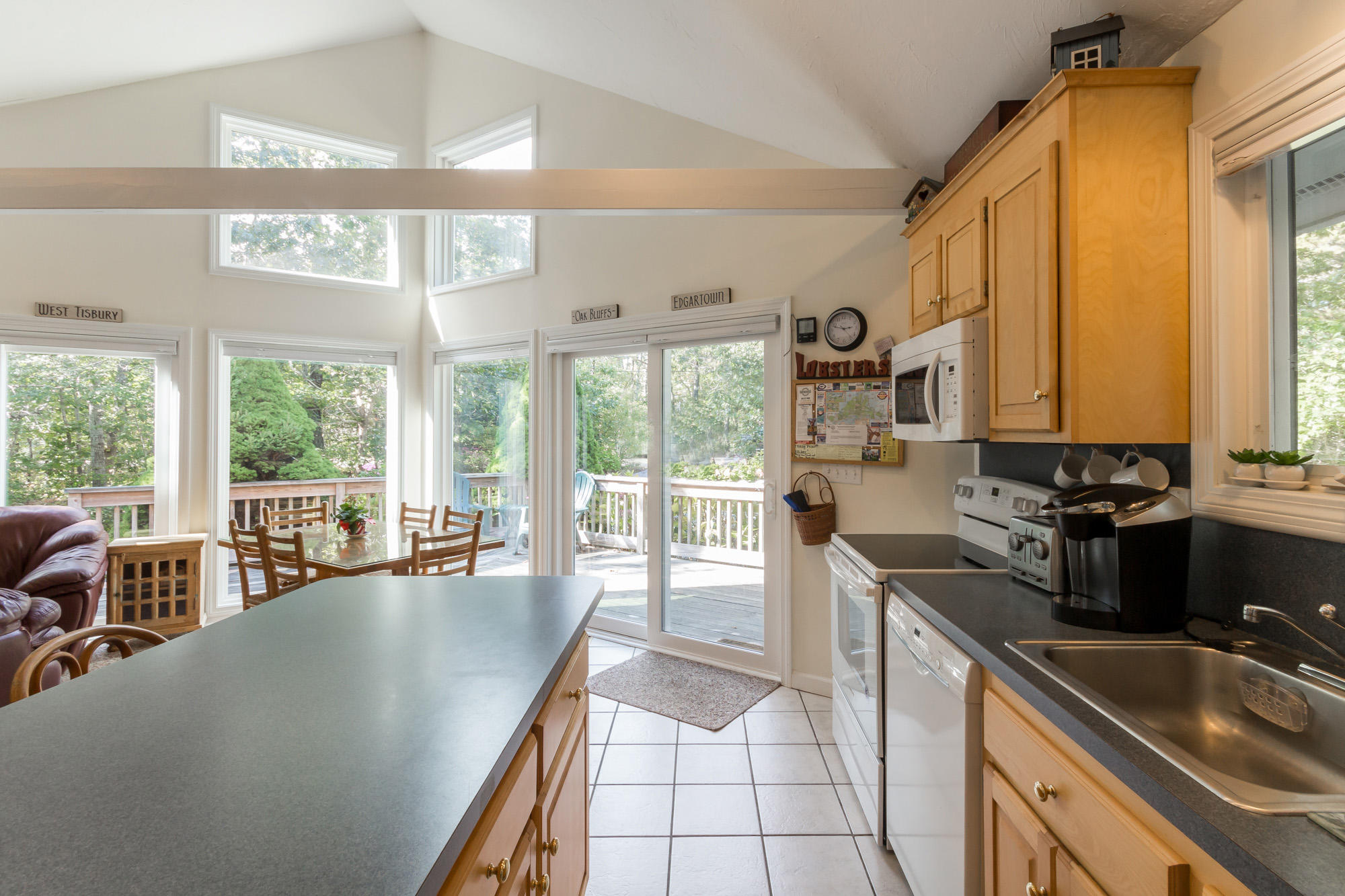 64 Rd To The Plaines Edgartown, MA 02539 - Photo 8 of 22 a large kitchen with kitchen island granite countertop a large window