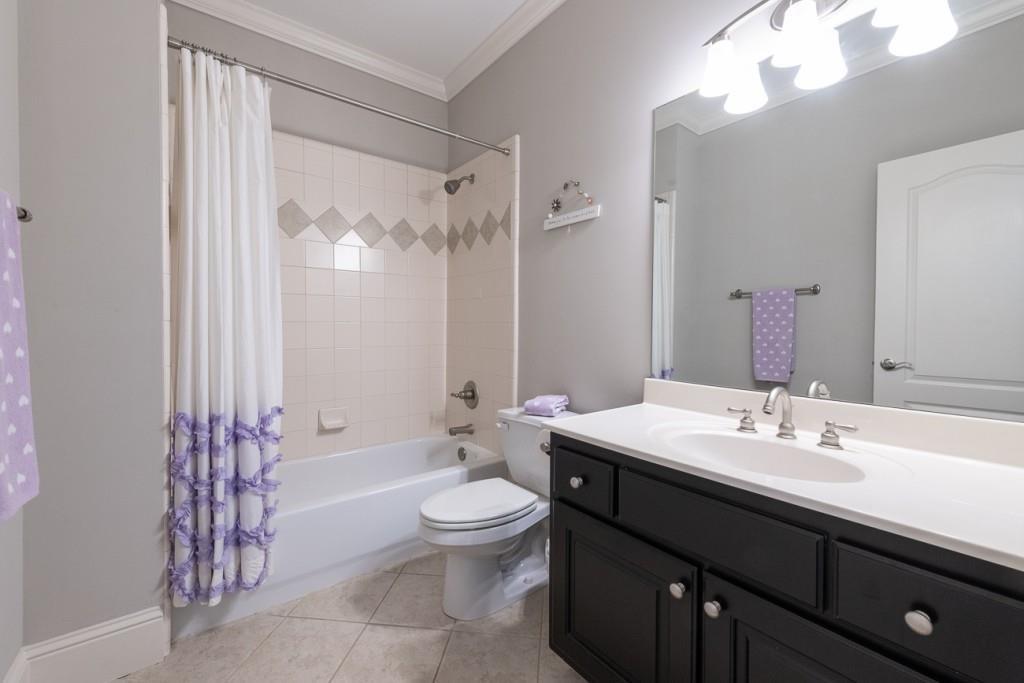 165 Autry Trail Alpharetta, GA 30022 - Photo 36 of 70 a bathroom with a sink a toilet a tub and mirror
