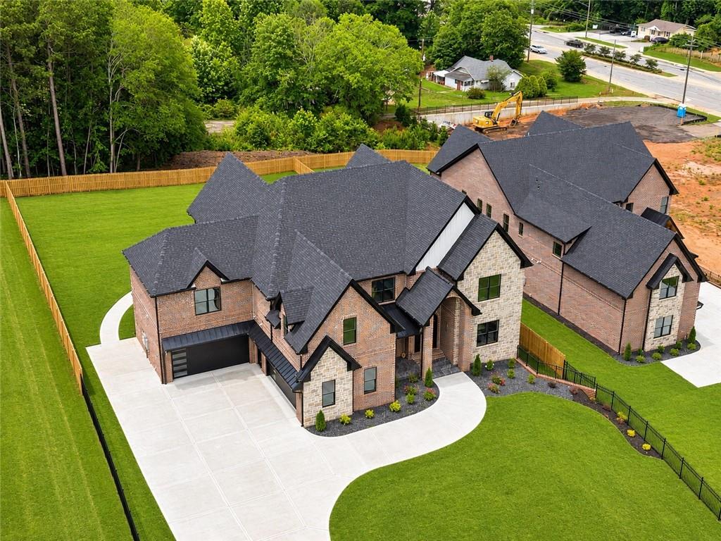 405 Thunder Road Buford, GA 30518 - Photo 8 of 104 an aerial view of a house with swimming pool garden and patio