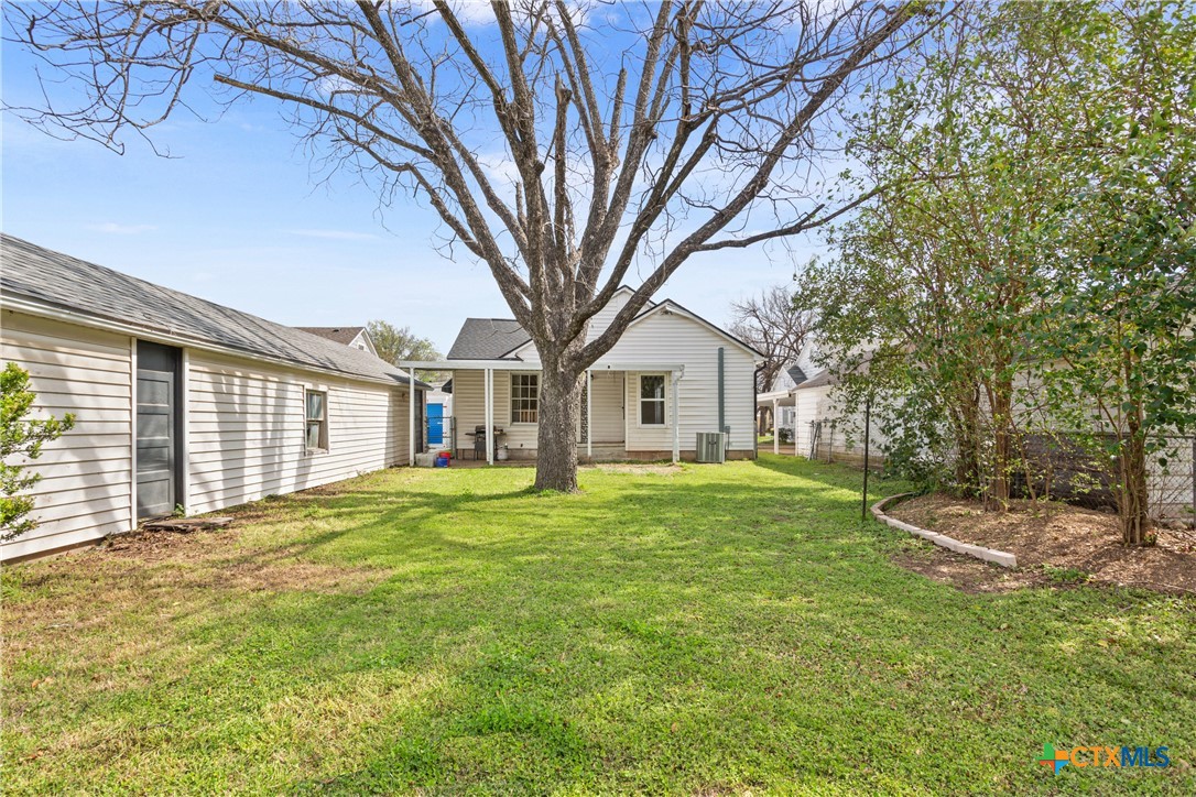 1206 Ashleman Street Waco, TX 76705 - Photo 25 of 26 a front view of a house with a yard