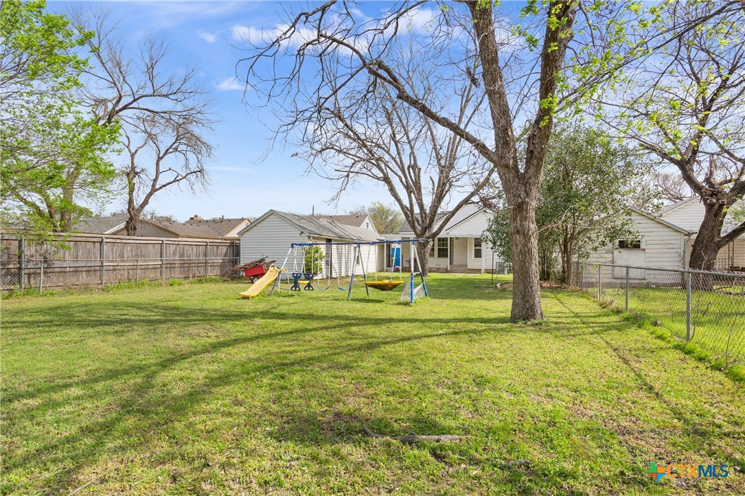 1206 Ashleman Street Waco, TX 76705 - Photo 26 of 26 a view of swimming pool with a big yard and large trees