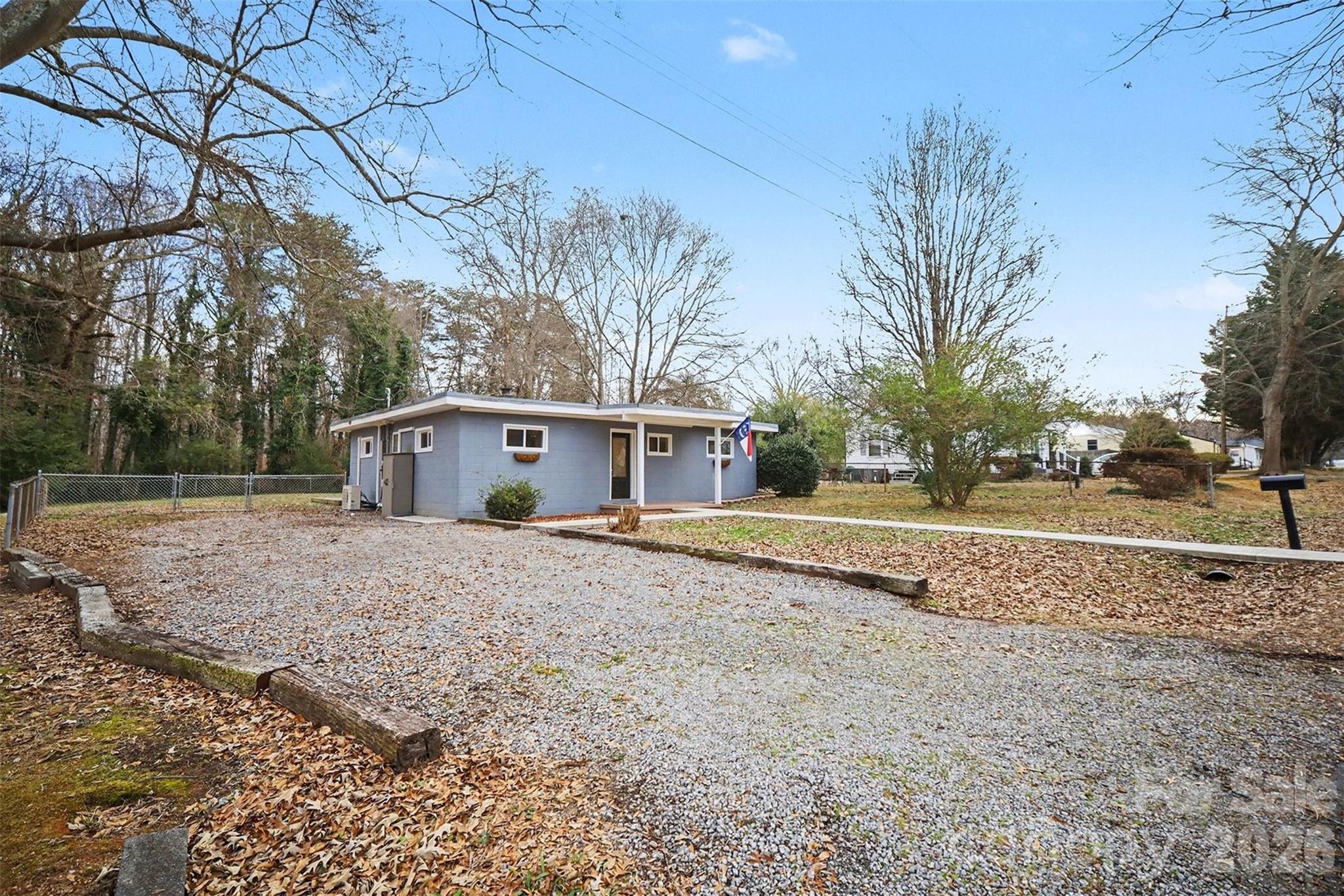 112 Lineberger Street Stanley, NC 28164 - Photo 12 of 32 a view of a house with a yard and garage