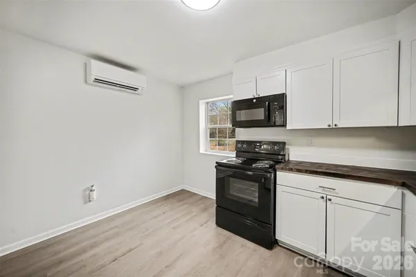 a kitchen with stainless steel appliances granite countertop a stove and a granite counter tops