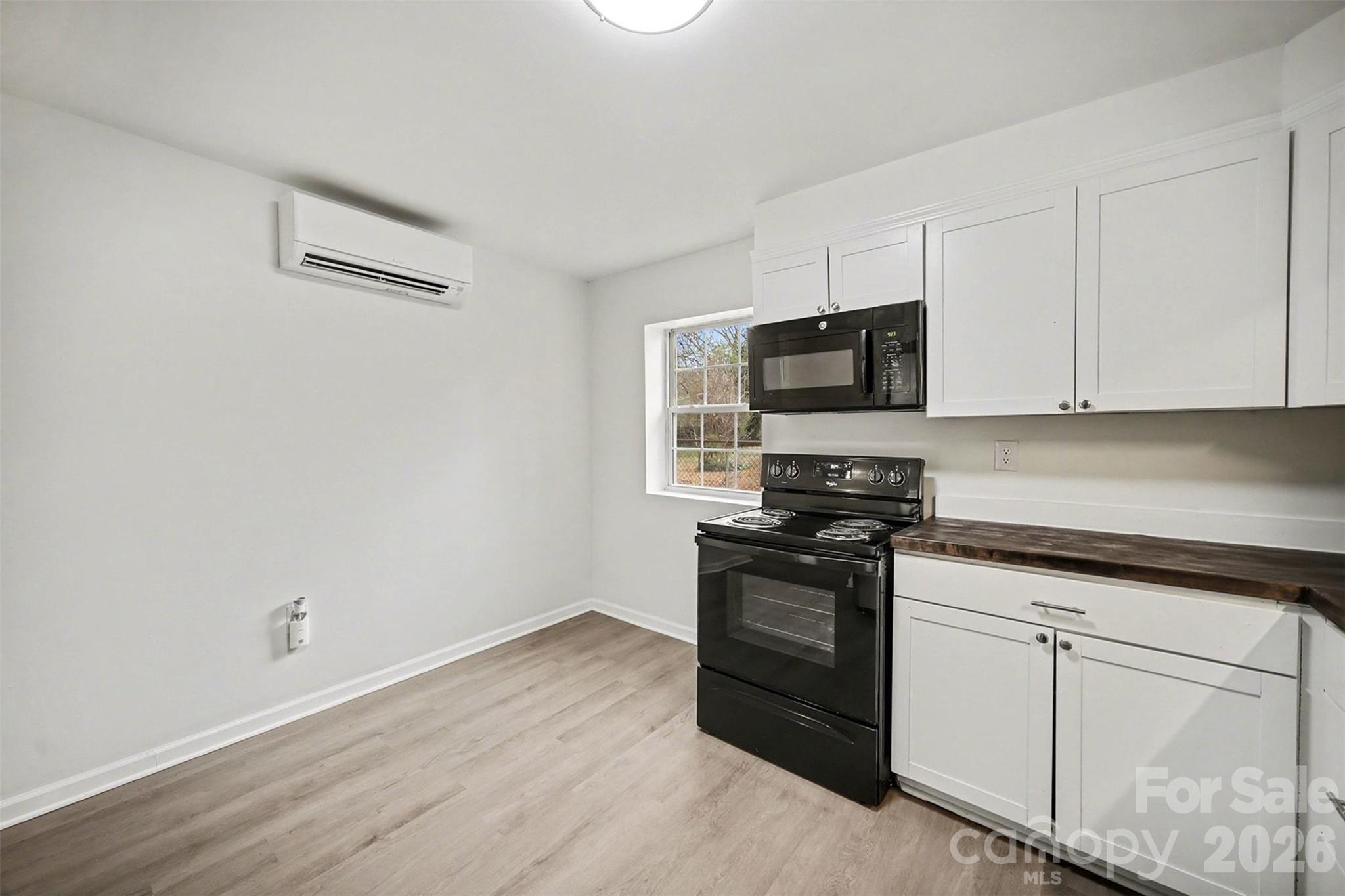 112 Lineberger Street Stanley, NC 28164 - Photo 18 of 32 a kitchen with stainless steel appliances granite countertop a stove and a granite counter tops