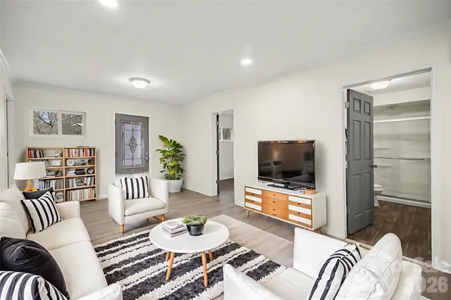 a living room with furniture and a flat screen tv