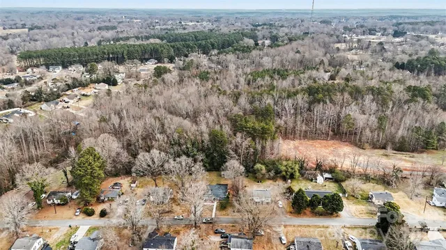 an aerial view of residential house with green space