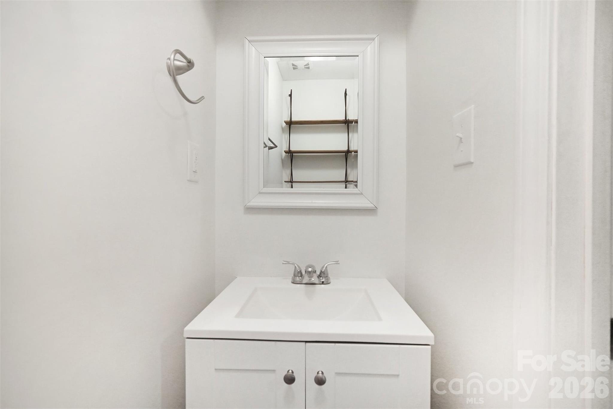 112 Lineberger Street Stanley, NC 28164 - Photo 5 of 32 a bathroom with a sink vanity and a window