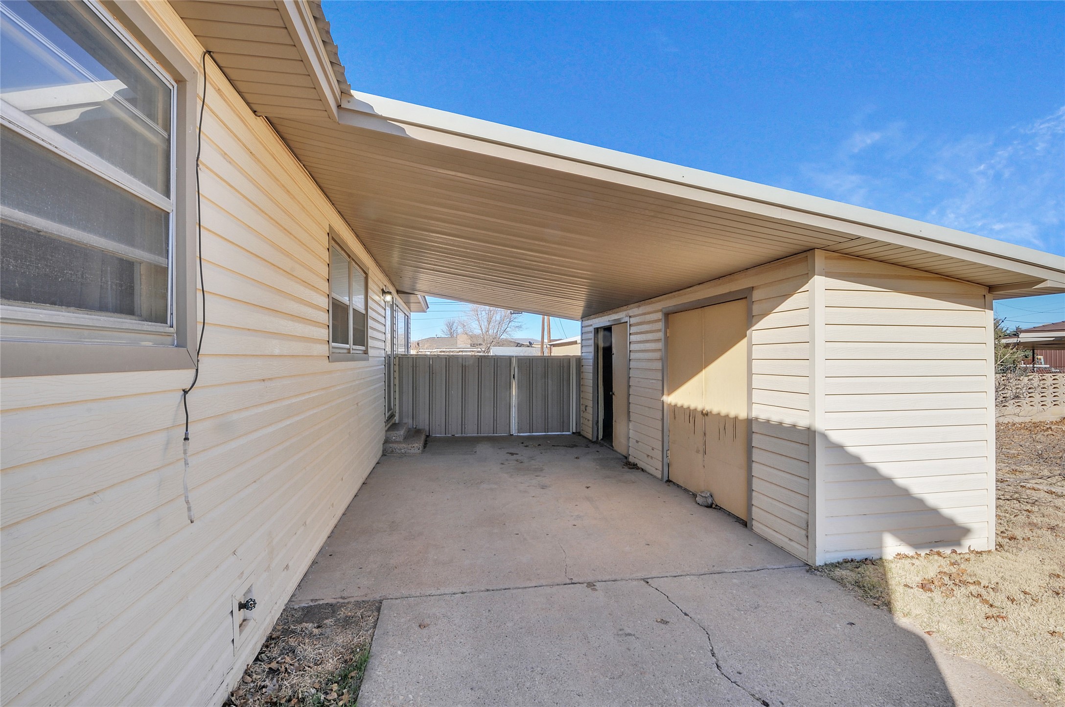 308 West 14th Street Friona, TX 79035 - Photo 2 of 21 Carport with Storage