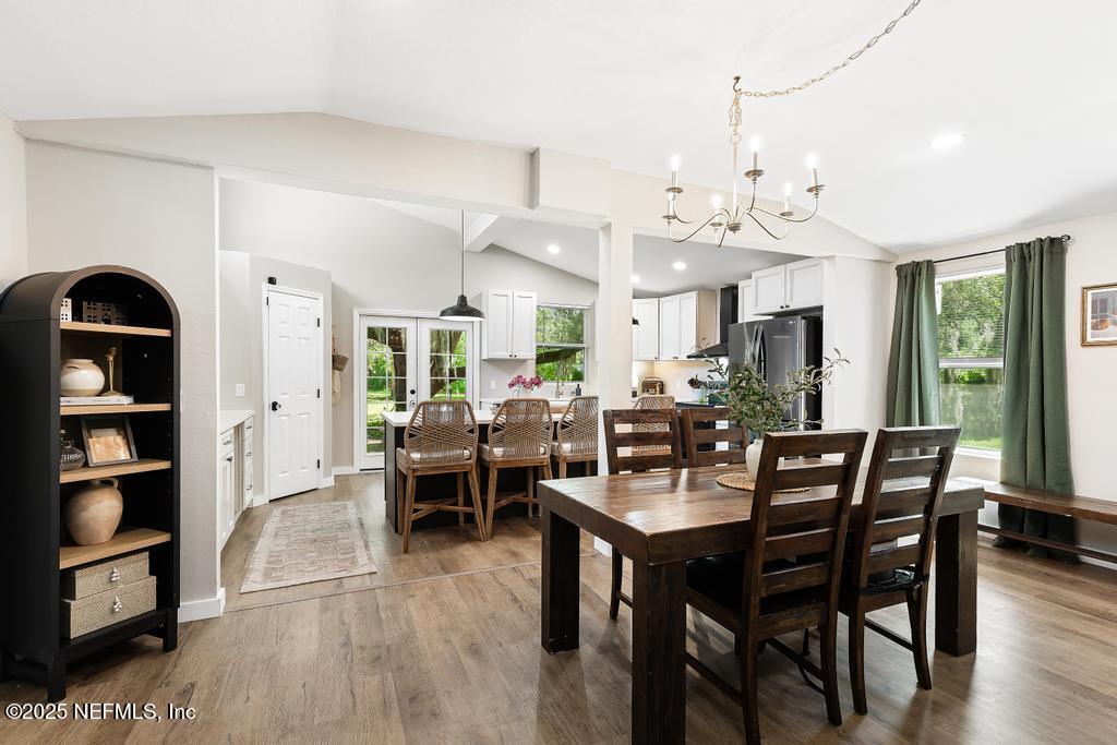 86290 Weldon Road Yulee, FL 32097 - Photo 11 of 50 a view of a dining room with furniture and wooden floor