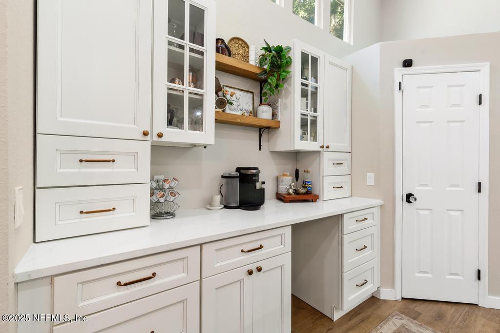 86290 Weldon Road Yulee, FL 32097 - Photo 12 of 50 a kitchen with cabinets and a wooden floor