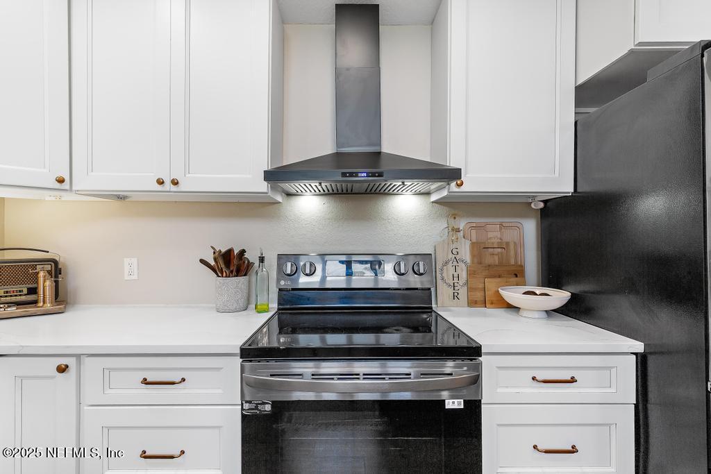 86290 Weldon Road Yulee, FL 32097 - Photo 14 of 50 a stove top oven sitting inside of a kitchen