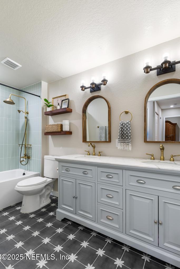 86290 Weldon Road Yulee, FL 32097 - Photo 23 of 50 a bathroom with double sink and a toilet