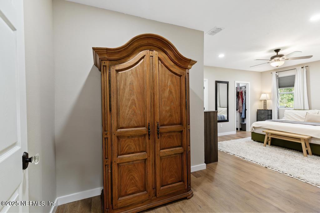 86290 Weldon Road Yulee, FL 32097 - Photo 28 of 50 a bedroom with a bed and a entryway