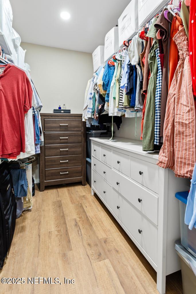 86290 Weldon Road Yulee, FL 32097 - Photo 30 of 50 a view of walk in closet with clothes