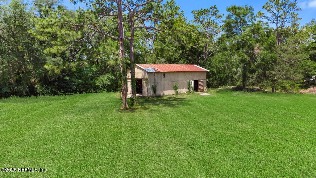 86290 Weldon Road Yulee, FL 32097 - Photo 37 of 50 a front view of a house with garden