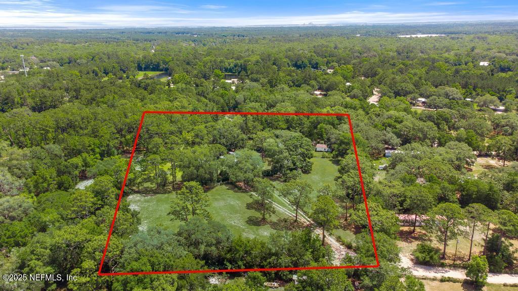 86290 Weldon Road Yulee, FL 32097 - Photo 44 of 50 a view of a city with lush green forest