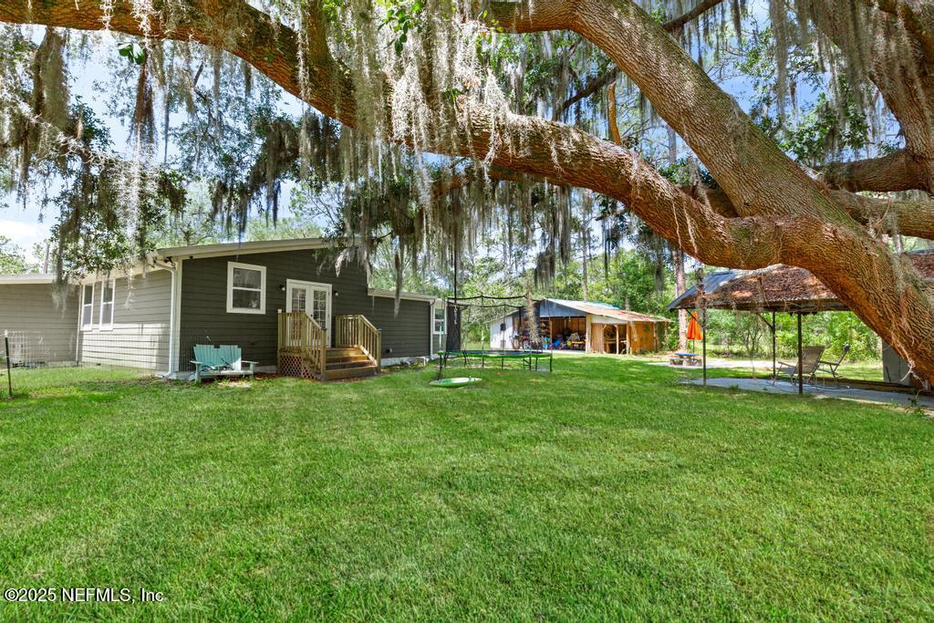 86290 Weldon Road Yulee, FL 32097 - Photo 48 of 50 front view of a house with a yard