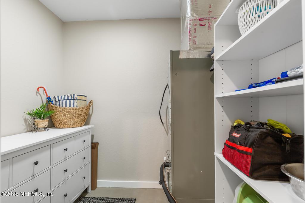 86290 Weldon Road Yulee, FL 32097 - Photo 6 of 50 a view of walk in closet with clothes and shoes