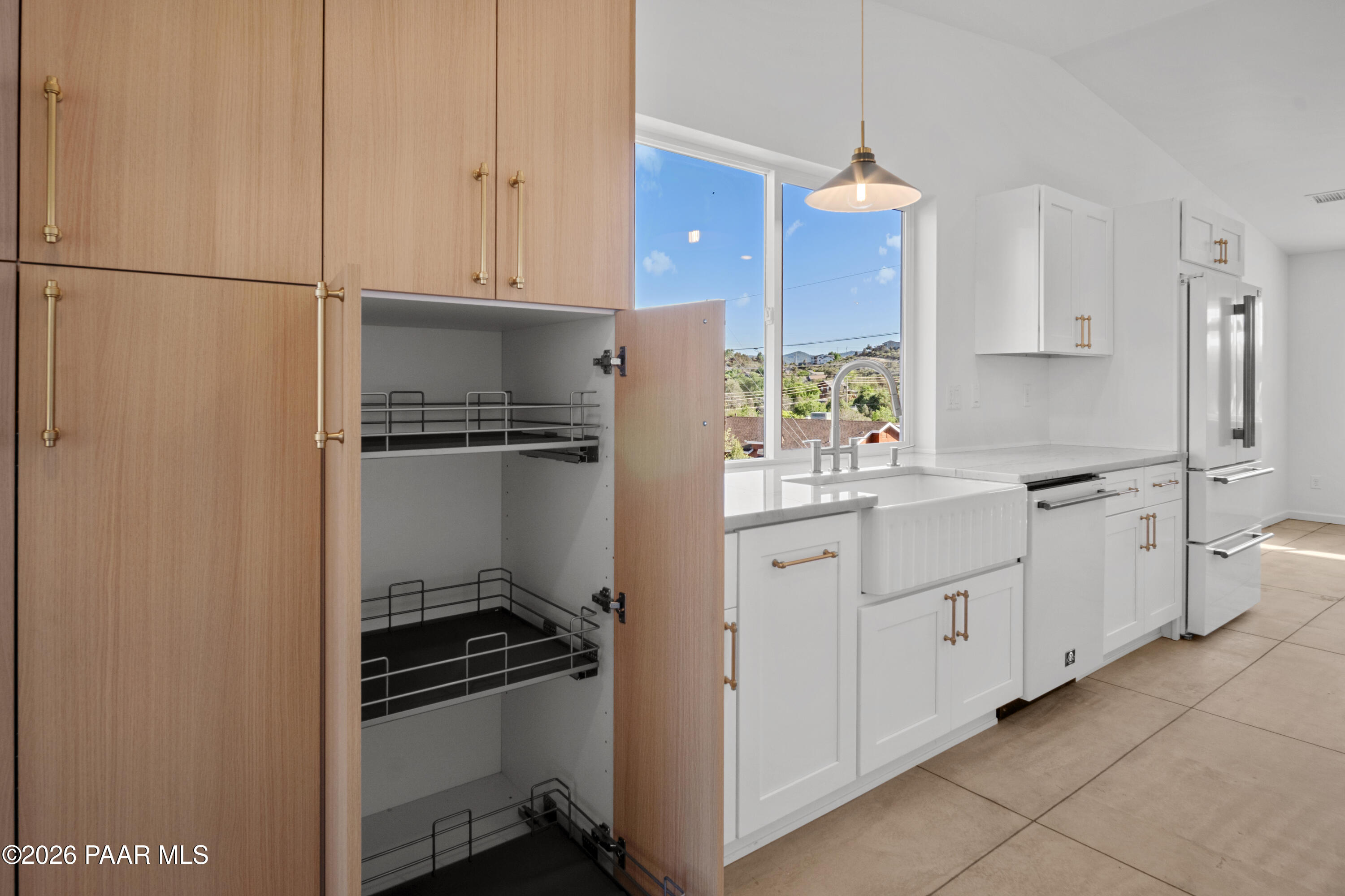 4920 East Amber Road Prescott, AZ 86301 - Photo 9 of 38 a kitchen with white cabinets and appliances