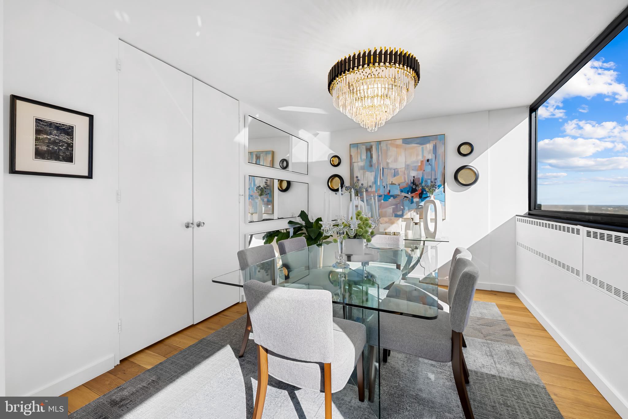 4000 North Charles Street, Unit 1414 Baltimore, MD 21218 - Photo 15 of 45 a view of a dining room with furniture and chandelier