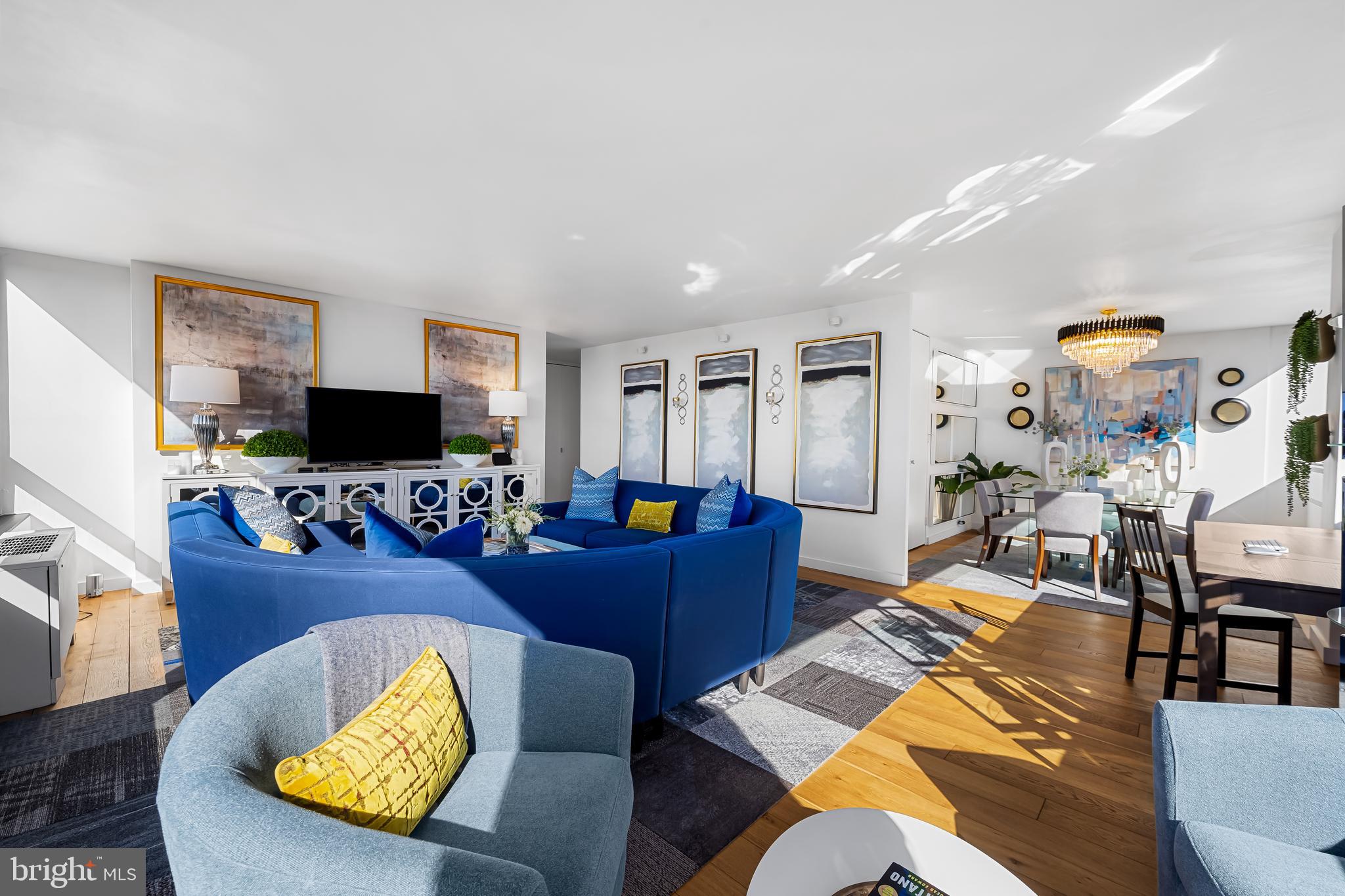 4000 North Charles Street, Unit 1414 Baltimore, MD 21218 - Photo 22 of 45 a living room with furniture and a flat screen tv