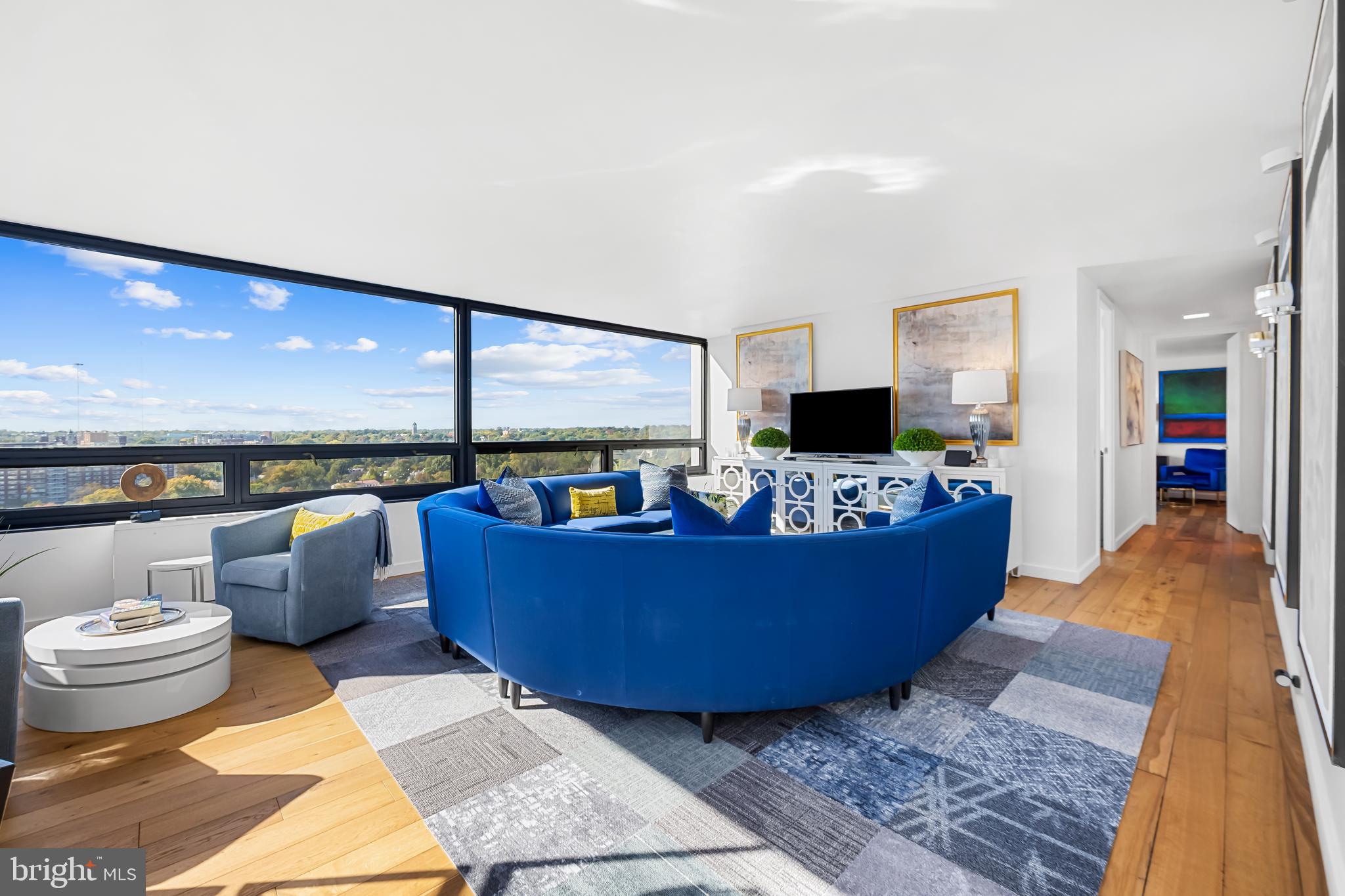 4000 North Charles Street, Unit 1414 Baltimore, MD 21218 - Photo 23 of 45 a living room with furniture and a flat screen tv