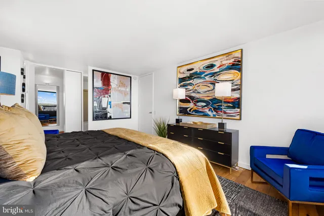 a bedroom with a bed and glass window