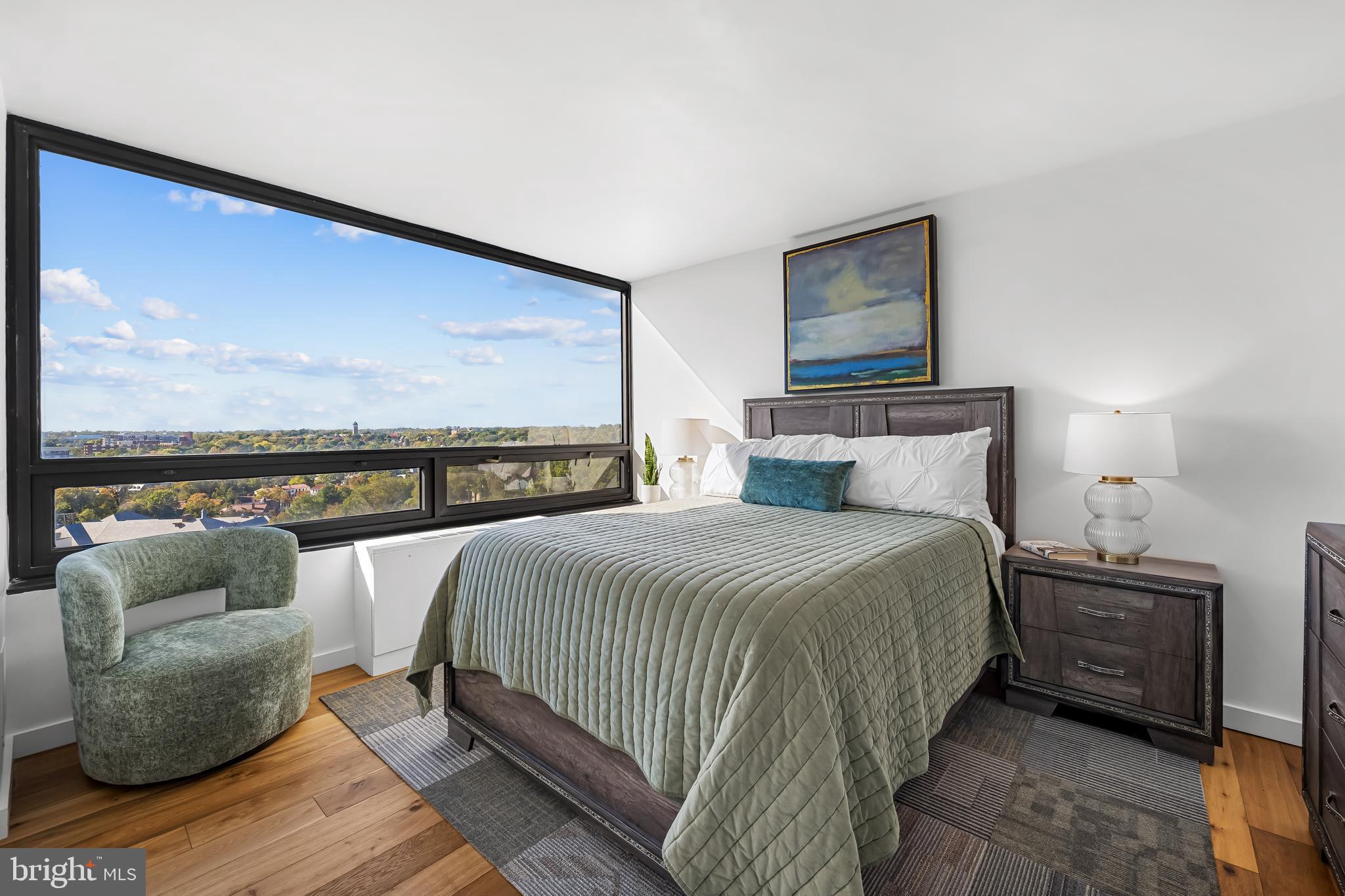 4000 North Charles Street, Unit 1414 Baltimore, MD 21218 - Photo 29 of 45 a bedroom with a bed and glass window