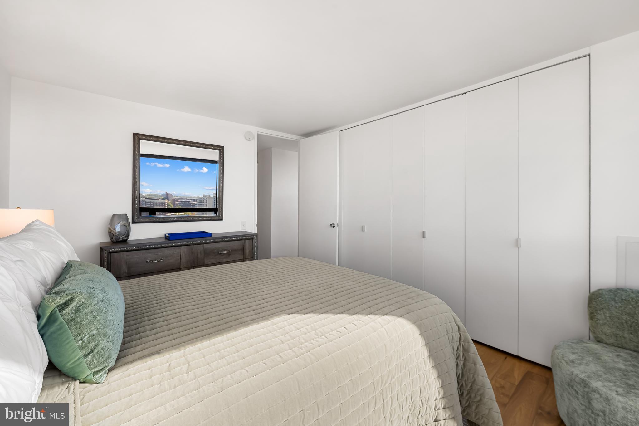 4000 North Charles Street, Unit 1414 Baltimore, MD 21218 - Photo 30 of 45 a bedroom with a bed and a couch